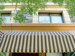 Retractable awning with stripes