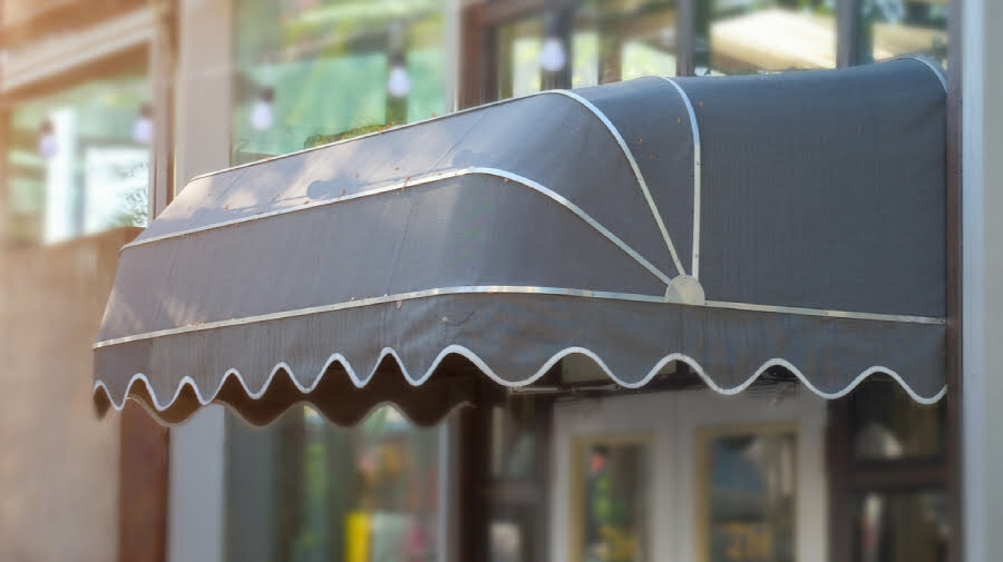 Gray door awning in front of a shop