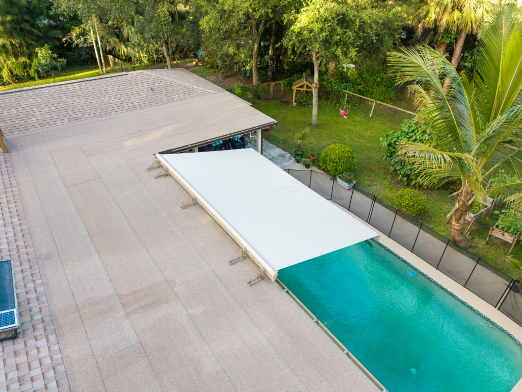 Retractable awning mounted to a roof in Jupiter Farms, FL