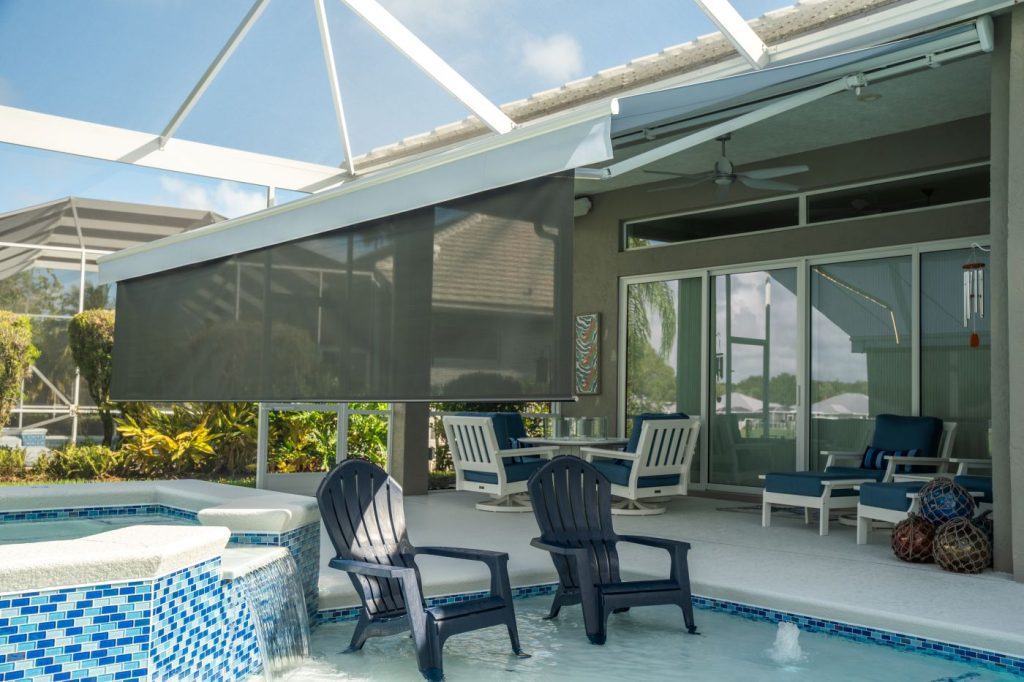 Retractable awning w/ drop screen installed at a Palm City home by Solarus USA