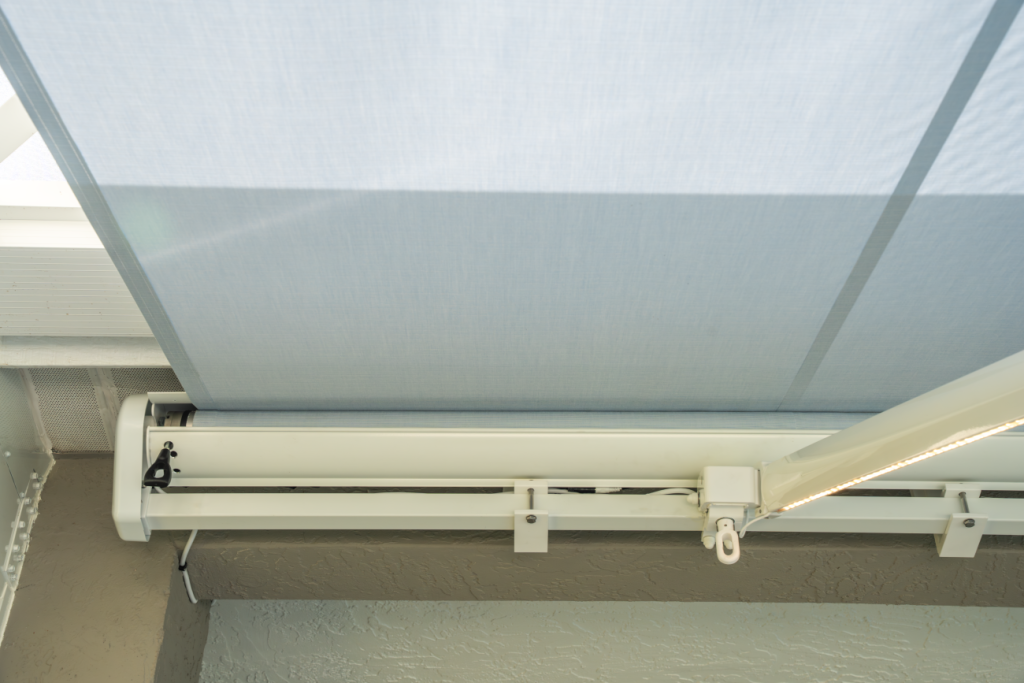 drop screen awning with wind sensor
