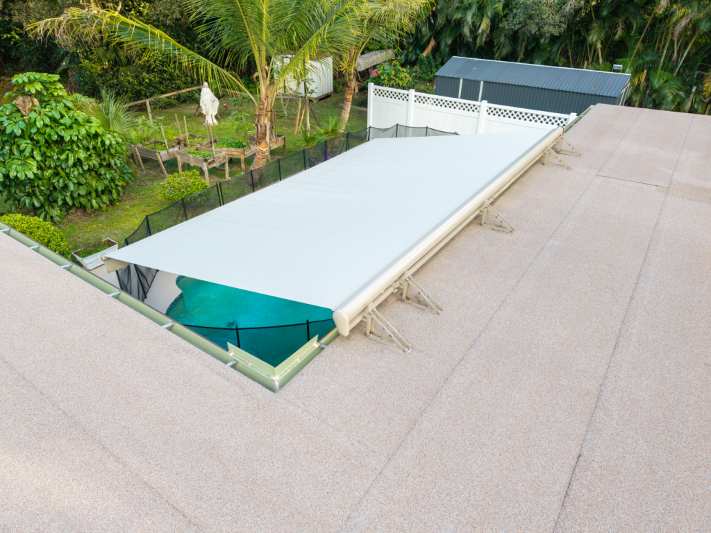 Roof mount awning installed to provide shade to a pool at a home in Jupiter Farms