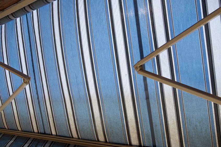 ceiling of a modern building with blue and white stripes.